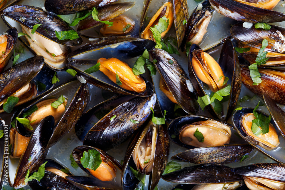 Mussels in garlic butter sauce. background Mussels in garlic butter sauce. background