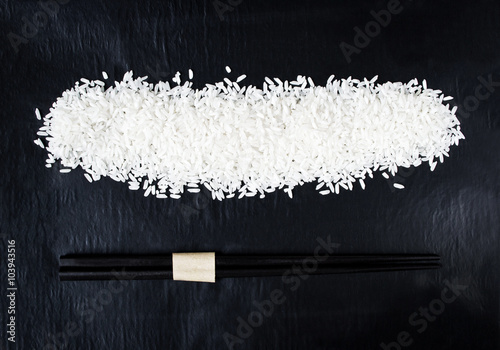 Fotografie Rice with chopsticks for background