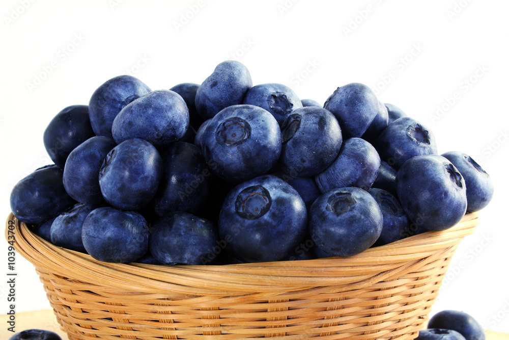 blueberries in bamboo basket on white background
blueberries in bamboo basket on white background