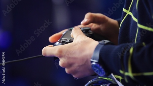 Playing games console close up, man playing video game with joystick 