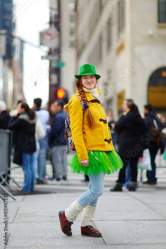 Young tourist having fun during the annual St. Patrick's Day Parade in New York