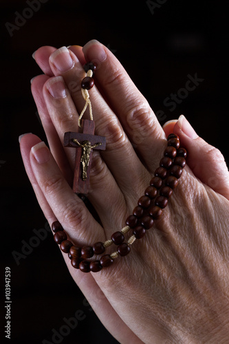 Rosary beads in hand