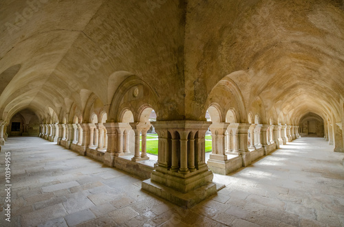 Beautiful view of the cloister courtyard of famous Cistercian Abbey of Fontenay, a UNESCO World Heritage Site since 1981, in the commune of Marmagne, Burgundy, France