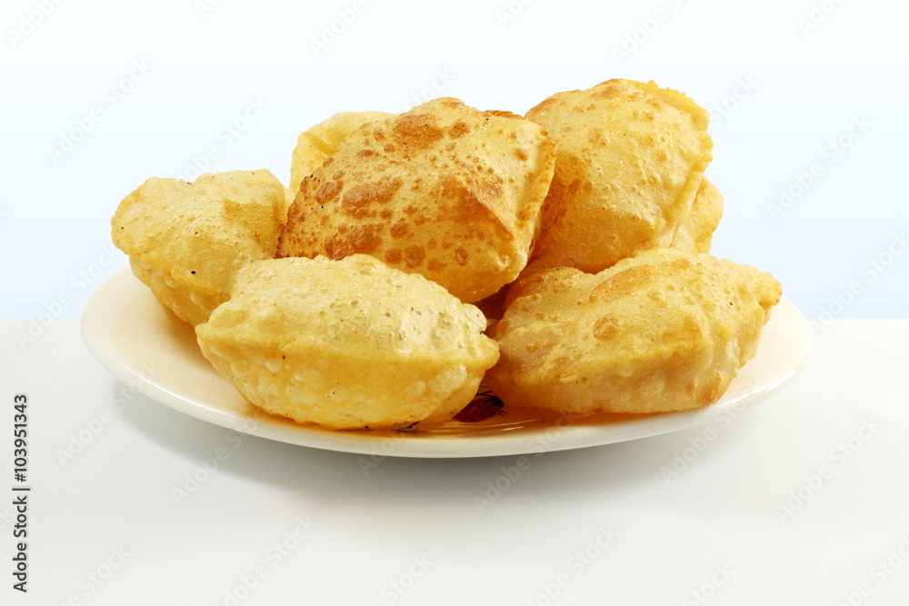 puri or Poori traditional indian homemade deep fried bread or chapati puri or Poori traditional indian homemade deep fried bread or chapati
