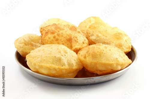 Fotografie puri or Poori traditional indian homemade deep fried bread or chapati