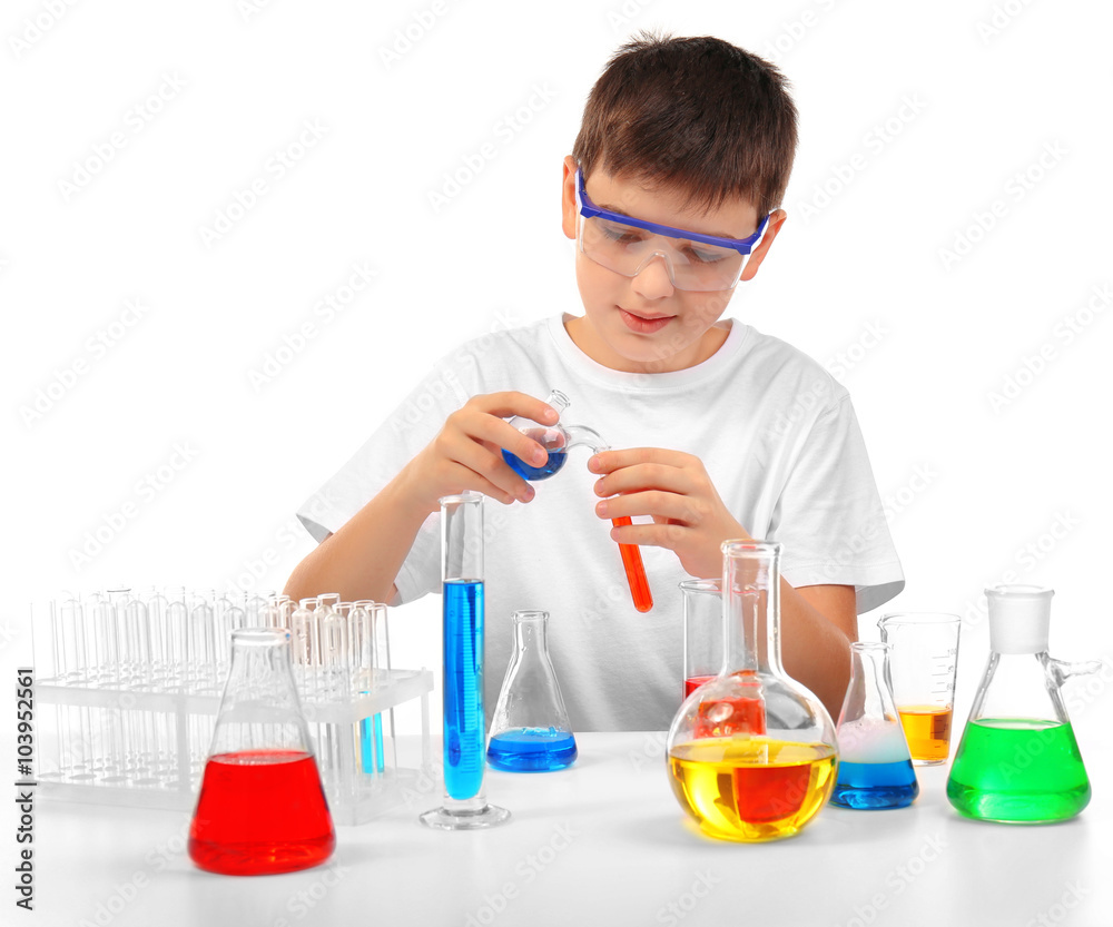 Clever little boy doing a chemical experiments, isolated on white