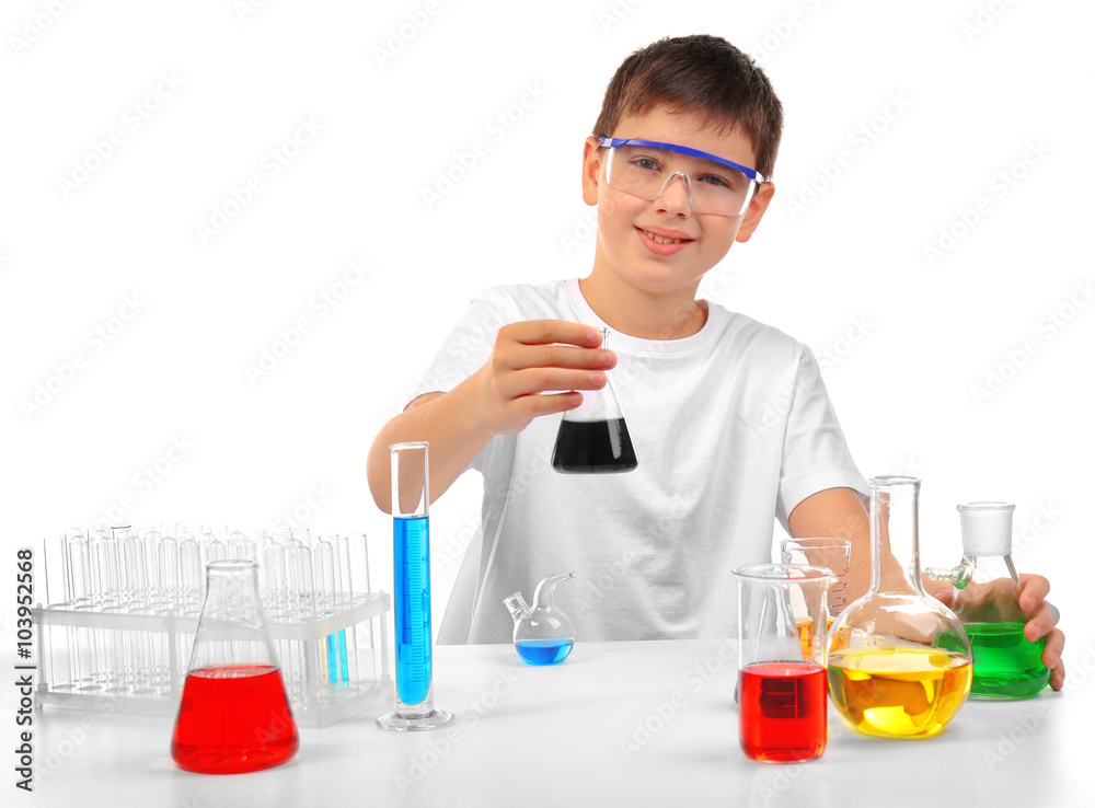 Clever little boy doing a chemical experiments, isolated on white