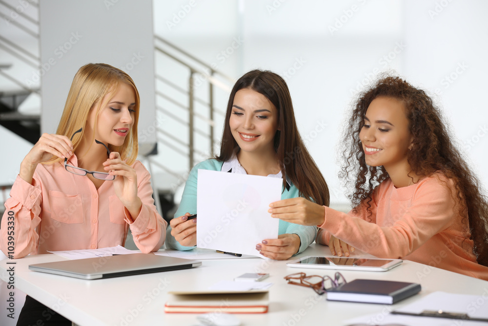 Young business people discussing a new project at the meeting in a conference room Young business people discussing a new project at the meeting in a conference room