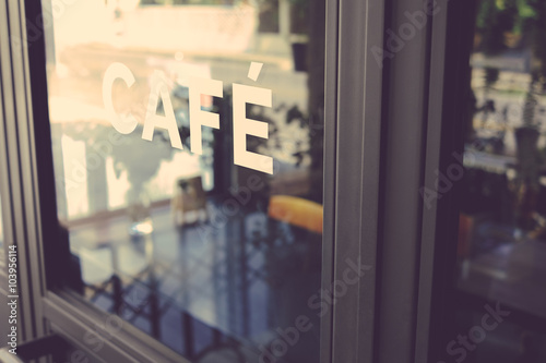 Alphabet cafe word on the window vintage color