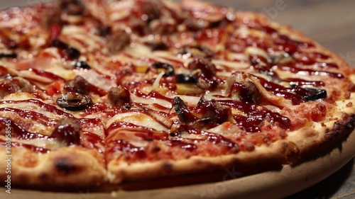 Close up pizza on an old wooden desk