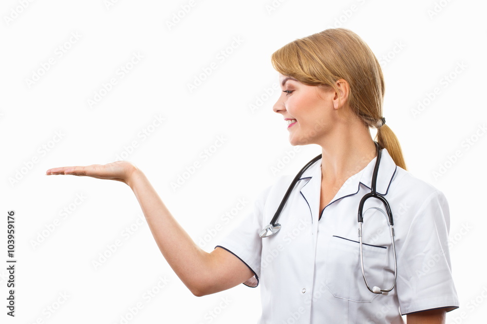 Woman doctor with stethoscope and empty hand, copy space for text, healthcare concept Woman doctor with stethoscope and empty hand, copy space for text, healthcare concept
