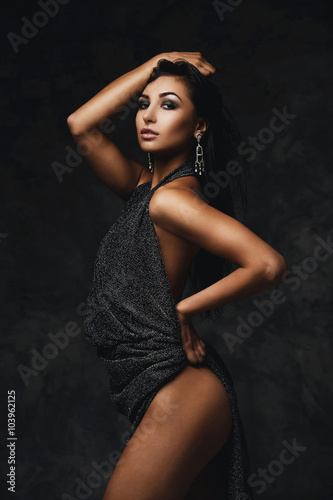 sexy raven indian lady posing seductively in front of camera