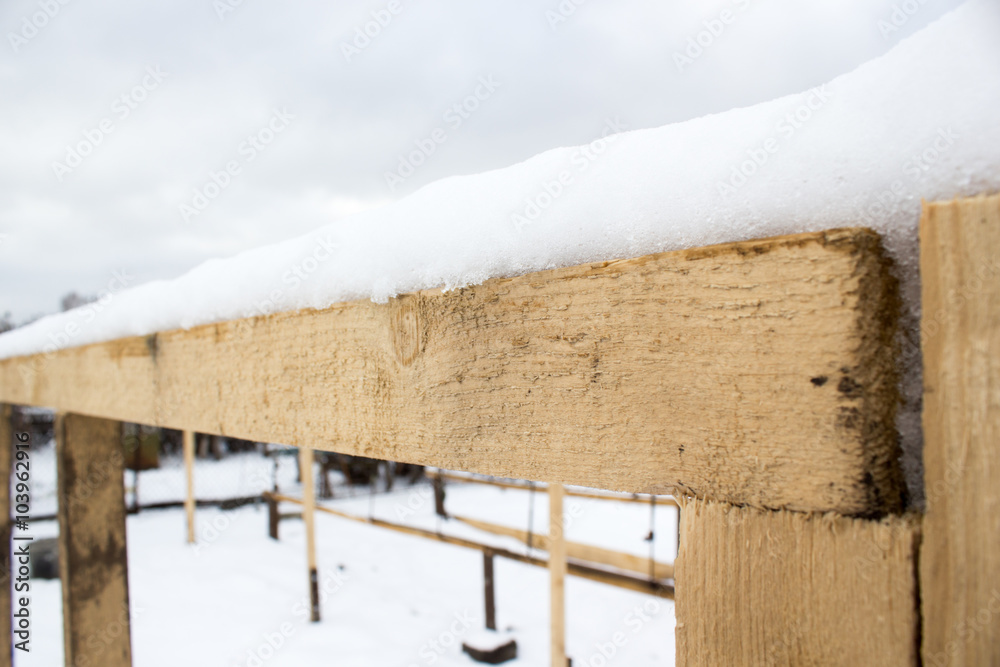 Wooden beams under the snow Wooden beams under the snow