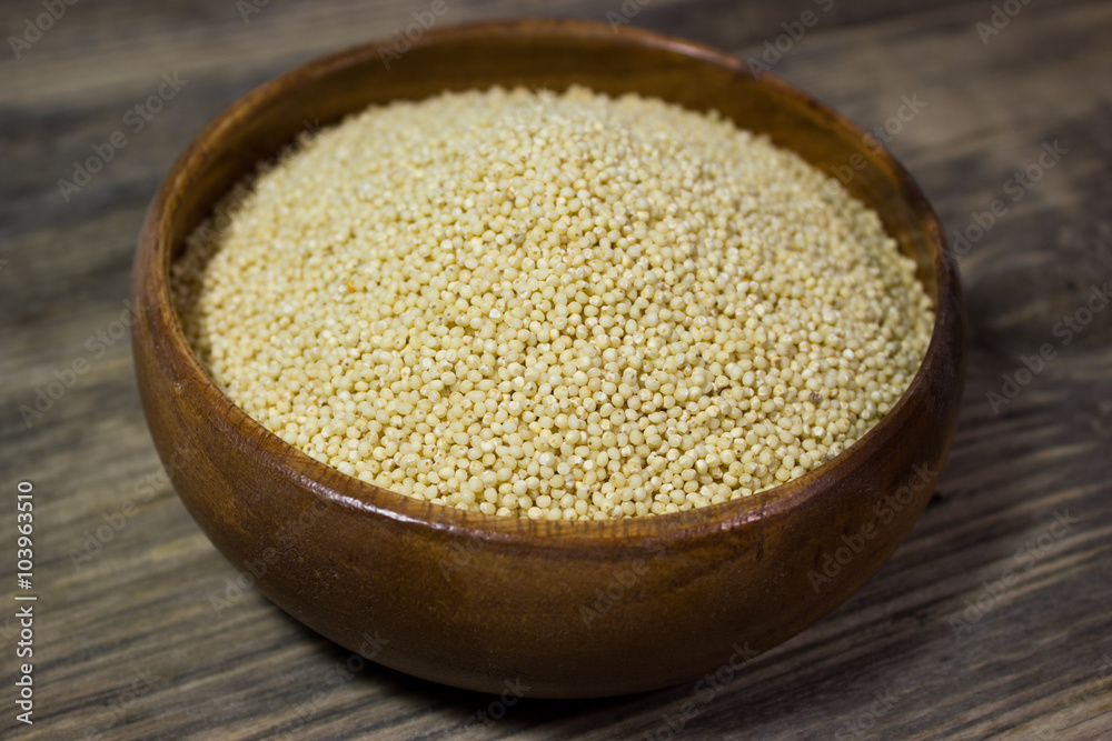 Couscous for a healthy diet on wooden background Couscous for a healthy diet on wooden background