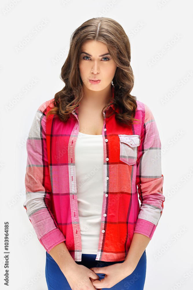 Portrait of disappointed girl looking at the camera.