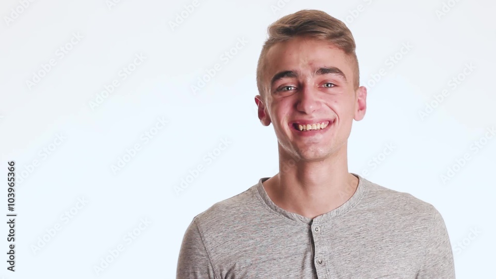 Handsome guy smiles and waves hello. The guy is very nice and amazing. Handsome guy smiles and waves hello. The guy is very nice and amazing.