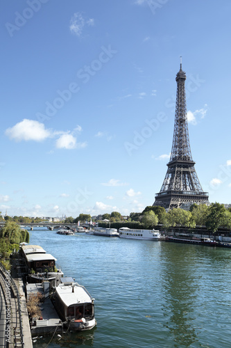 Eiffel Tower Paris France vertical landscape looking across river seine and boats in the foreground photo vertical © david_franklin