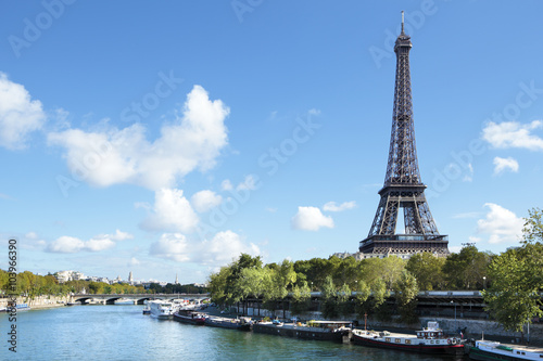 Eiffel Tower Paris France vertical landscape looking across river seine and boats in the foreground photo vertical © david_franklin