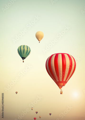Hot air balloon on sun sky with cloud, vintage and retro filter effect style