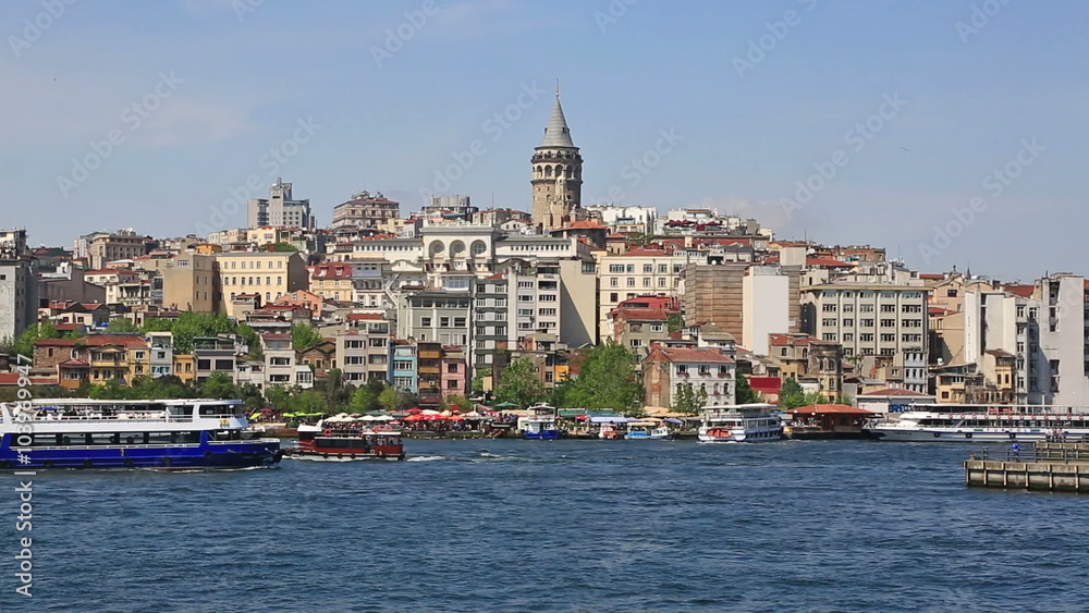Scenic view at crowded Golden Horn embankment and The Galata bridge in sunny summer day. Scenic view at crowded Golden Horn embankment and The Galata bridge in sunny summer day.