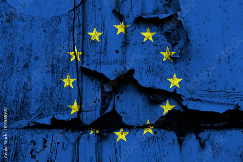 EU flag on old tattered paper as symbol of European Union disintegration and its contemporary problems (Euro, Grexit, Brexit, Visegrad four, Schengen area)