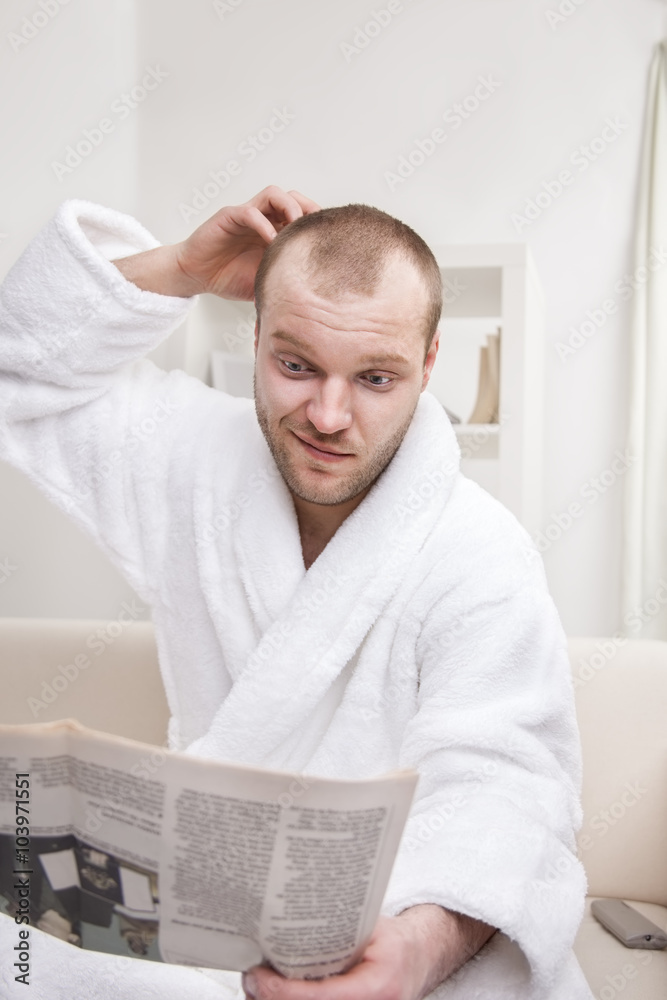 Obraz premium young man with newspaper