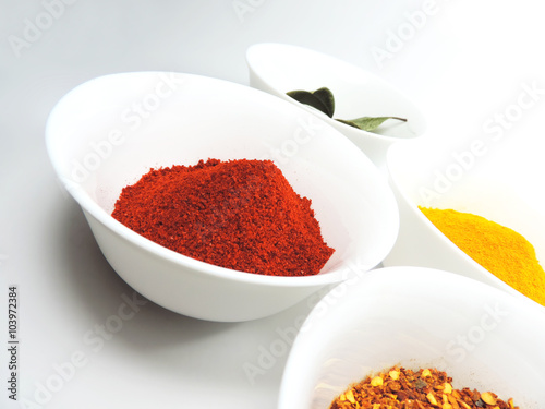 Fototapeta Naklejka Na Ścianę i Meble -  Variation of spices, paprika powder, curry, chili powder and laurel leafs