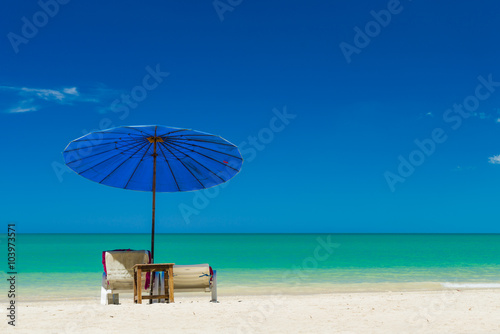 Fototapeta Naklejka Na Ścianę i Meble -   lounge chairs with sun umbrella on a beach