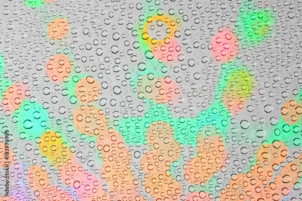 Obraz premium Drops of water on glass colorful background.