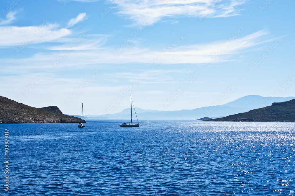 Sailing boat on Aegean sea near Nisyros Island Sailing boat on Aegean sea near Nisyros Island
