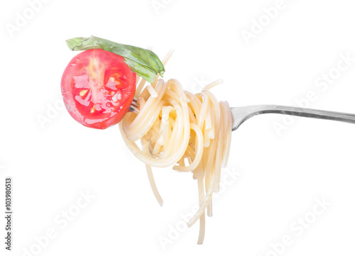 Pasta with tomato on a fork isolated on white background