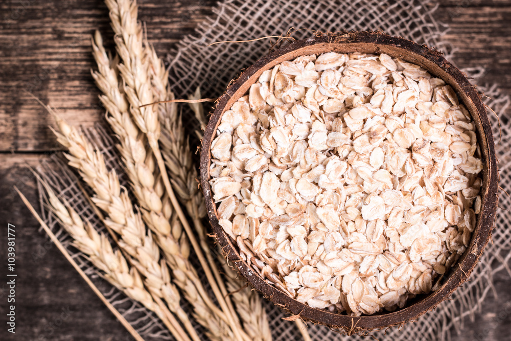 oat flakes on wooden table.healthy food concept. oat flakes on wooden table.healthy food concept.
