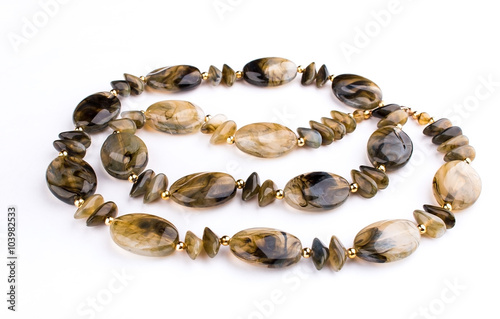 Necklace made of natural stones on a white background