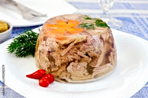 Foto Jellied with pepper and dill on tablecloth
