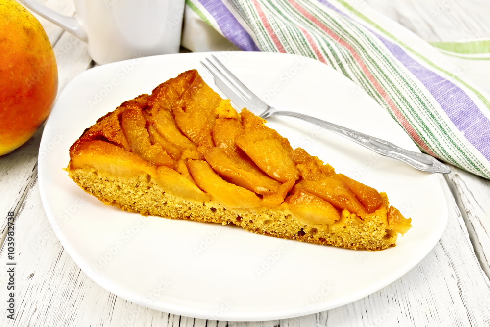 Pie with pears and honey in plate on light board Pie with pears and honey in plate on light board