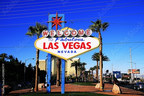 The Welcome to Fabulous Las Vegas sign on bright sunny day in Las Vegas.Welcome to Never Sleep city Las Vegas, Nevada Sign with the heart of Las Vegas scene in the background.
