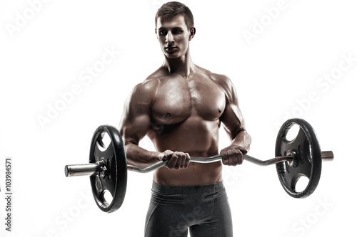 Young handsome man with naked torso and barbell 
