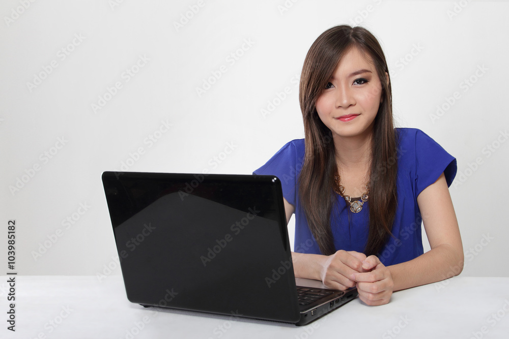 Young Asian woman and her laptop isolated Young Asian woman and her laptop isolated