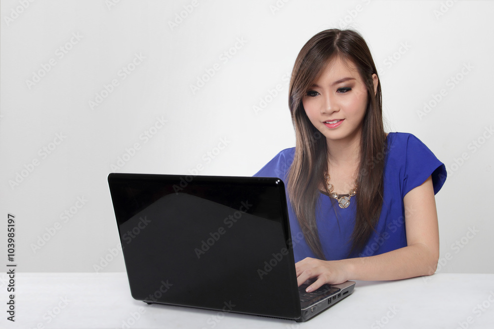 Young Asian woman working with laptop isolated Young Asian woman working with laptop isolated