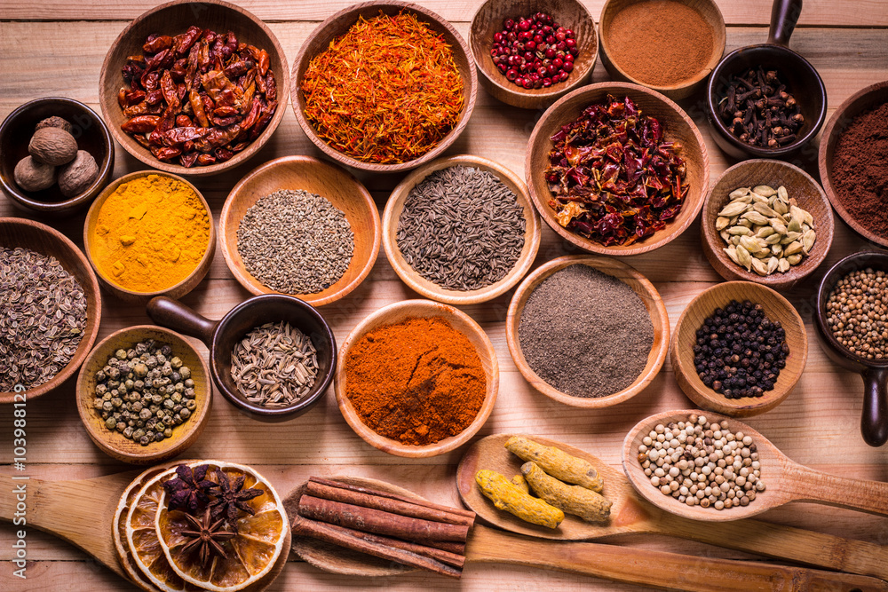 spices and herbs on wooden table.