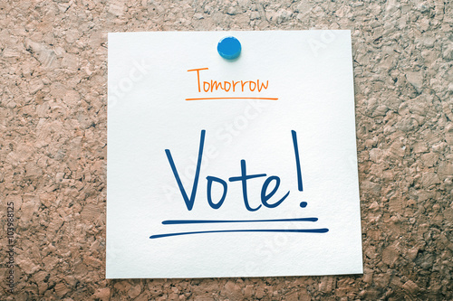 Vote Reminder For Tomorrow On Paper Pinned On Cork Board