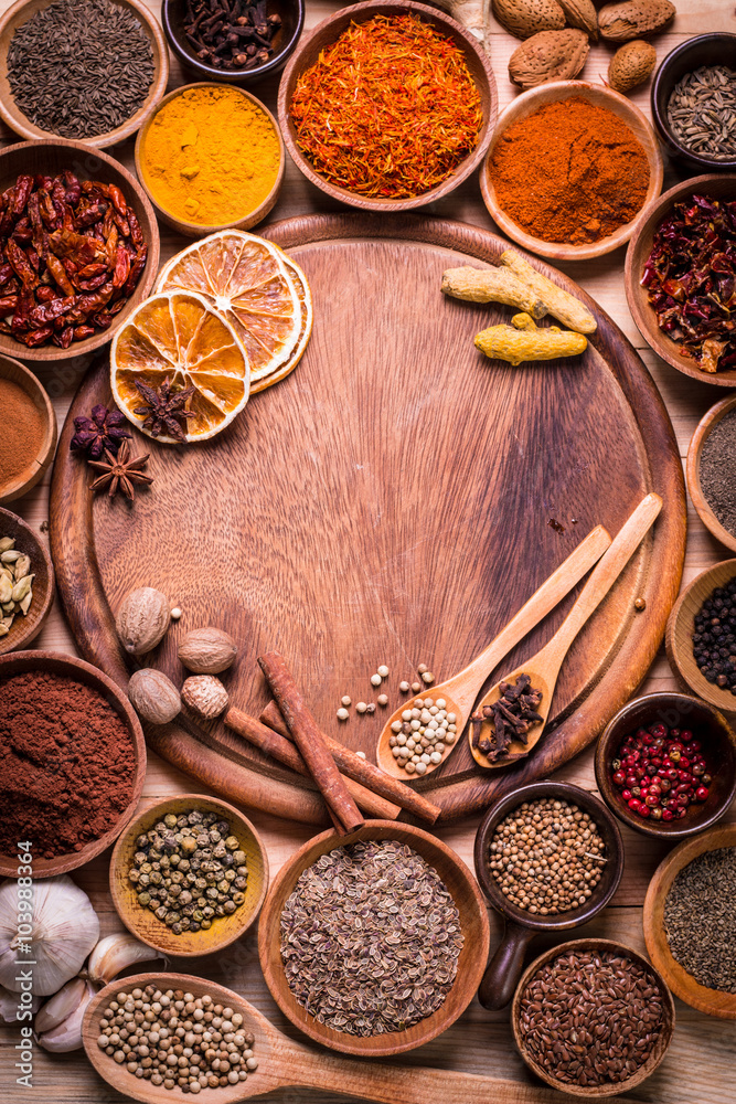 spices and herbs on wooden table. spices and herbs on wooden table.