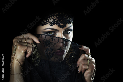 Tableau sur toile Beautiful caucasian young woman with black veil on face