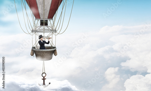 Woman traveling in aerostat photo