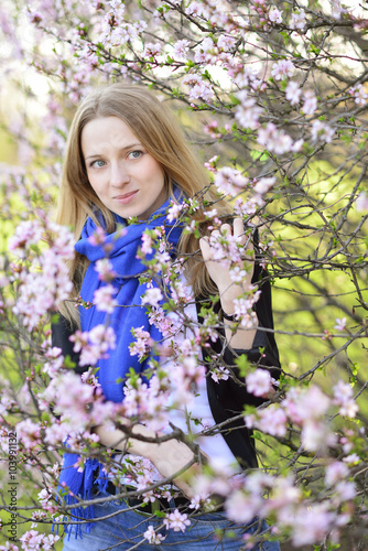 young blond woman, flowering spring trees, cherry © Stanislav Samoylik
