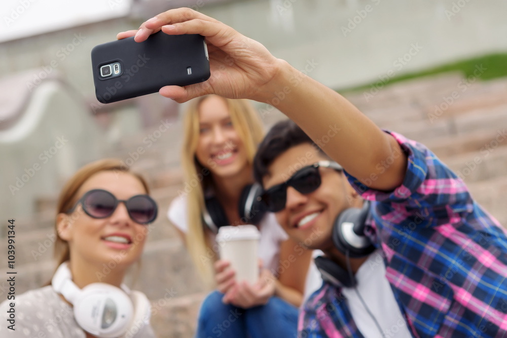 Obraz premium Make selfie photos with friends