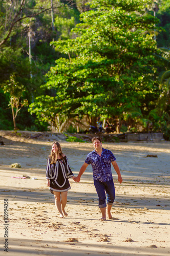 Joyful honeymoon couple playing on a beach in Phuket, Thailand © Iosif Yurlov