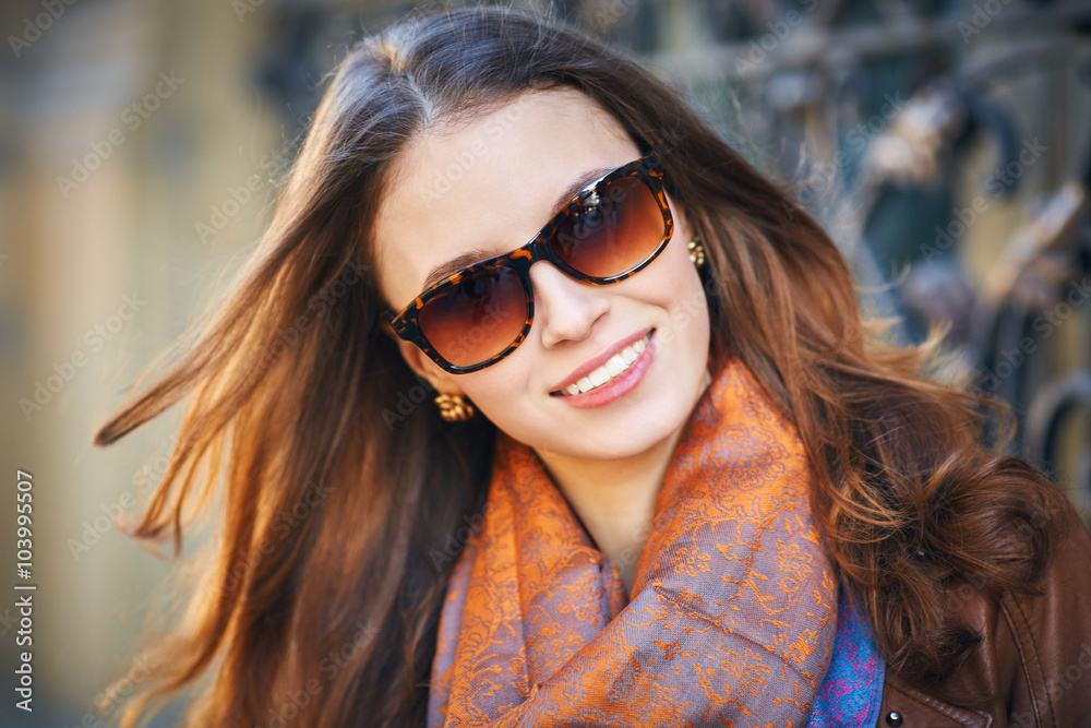 Outdoor portrait of beautiful redhead young woman in sunglasses Outdoor portrait of beautiful redhead young woman in sunglasses