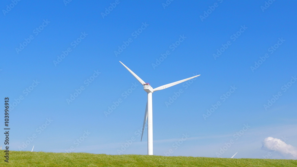Wind turbine in green field with small clouds in spring
Wind turbine in green field with small clouds in spring
