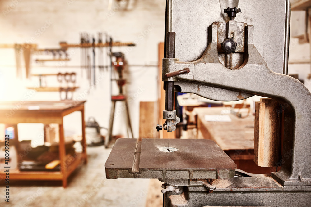 Fototapeta premium Well-used jig saw machine in a woodwork workshop